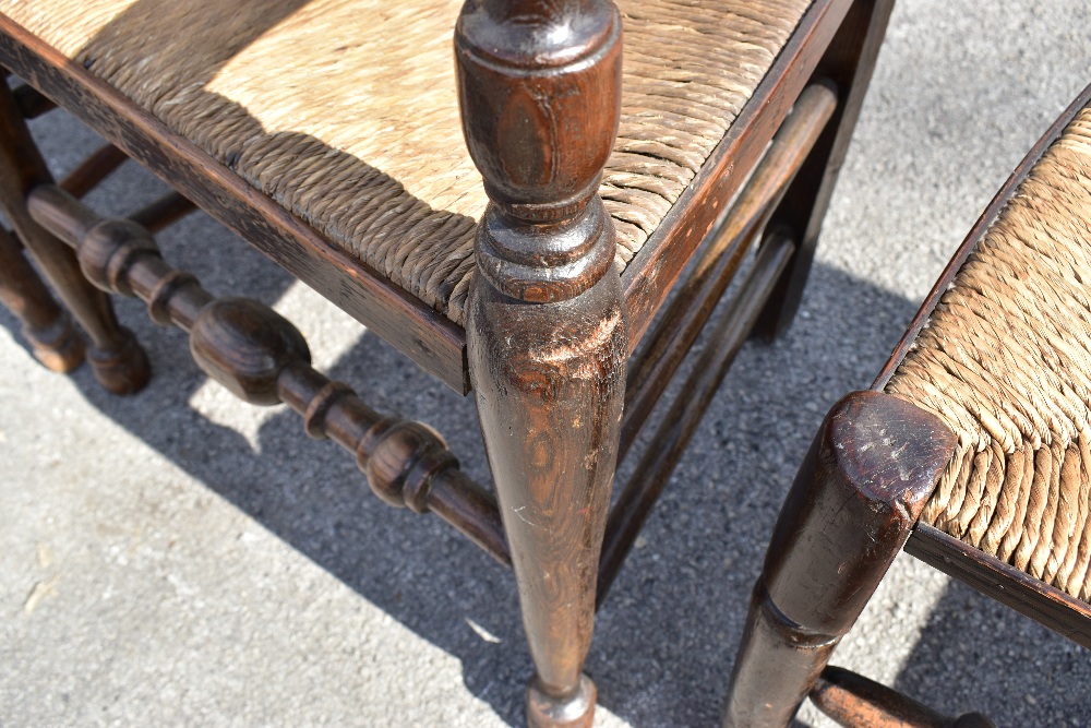 A matched set of six 19th century and later rush seated spindle back chairs, to include an elm - Image 3 of 4