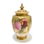 ROYAL WORCESTER;  a blush ivory potpourri vase and cover, painted throughout with roses in the