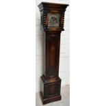 An early 20th century oak cased longcase clock of small proportions, the brass face with applied