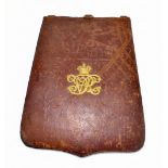 A Victorian maroon leather dispatches folder with gilt VR Royal cipher to front and pouch to