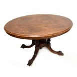 A 19th century walnut, burr walnut and marquetry loo table on fluted supports to four outswept