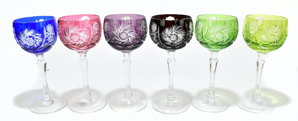 A set of six Bohmemian cut coloured hock glasses with faceted, waisted stems on circular bases,