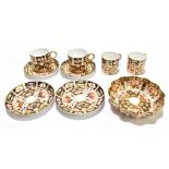 ROYAL CROWN DERBY; two pairs of Imari coffee cans and saucers, pattern no.2451, with a shaped oval