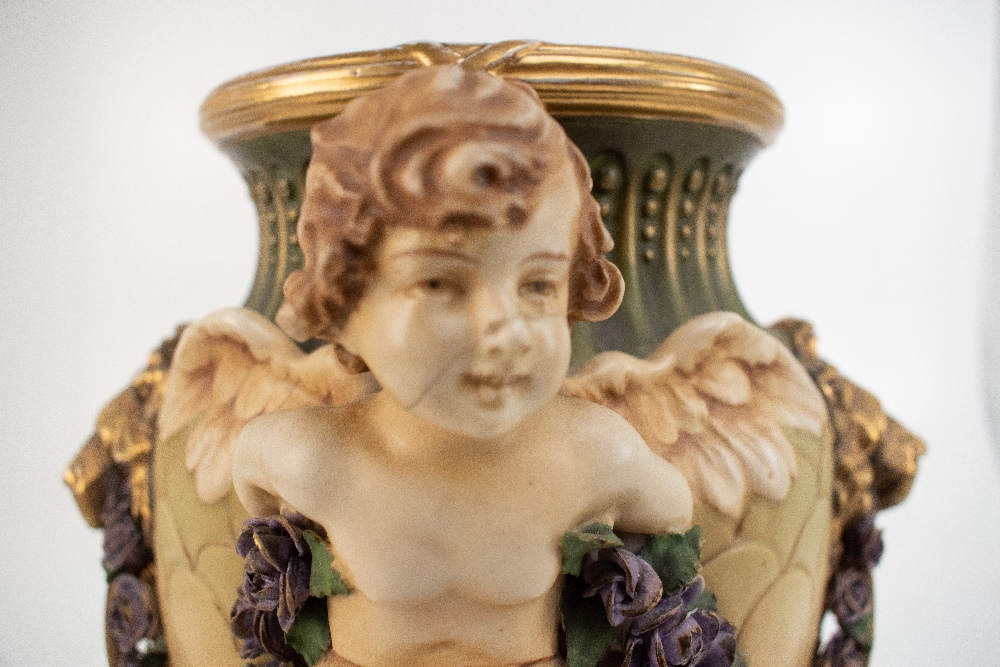 AMPHORA; an Austrian bisque porcelain vase of tapered form with applied winged cherub, moulded - Image 2 of 8