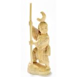 A late 19th century Japanese carved ivory okimono of boy on a shaped oval base, height 19.5cm (af).