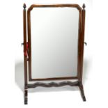 An early 20th century mahogany swing toilet mirror, height 59cm, width 38cm.