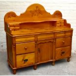 A Victorian and later pine chiffonier, the raised back with two small drawers above three serpentine