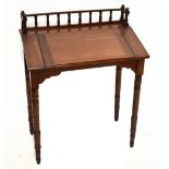 A late Victorian mahogany clerk's desk with gallery back above hinged slope, raised on turned column