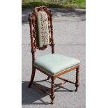 A Victorian carved walnut side chair, with floral bead work upholstered back and later green