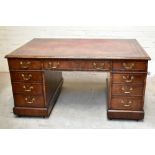 A George III mahogany partners' desk, the red leather inset top with a moulded edge above an