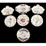 Six 19th century ironstone moulded dessert dishes comprising an example painted with floral sprigs