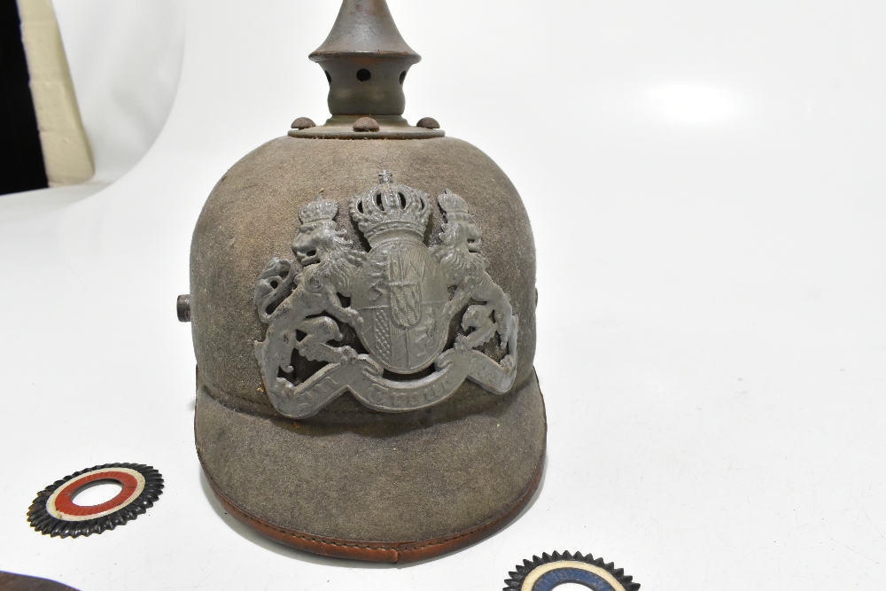 A late 19th/early 20th century German Imperial pickelhaube in green felt with two rosettes, chin - Image 2 of 4