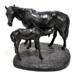 KASLI; a Russian cast iron model of a mare and a foal on shaped oval base, signed to the front right