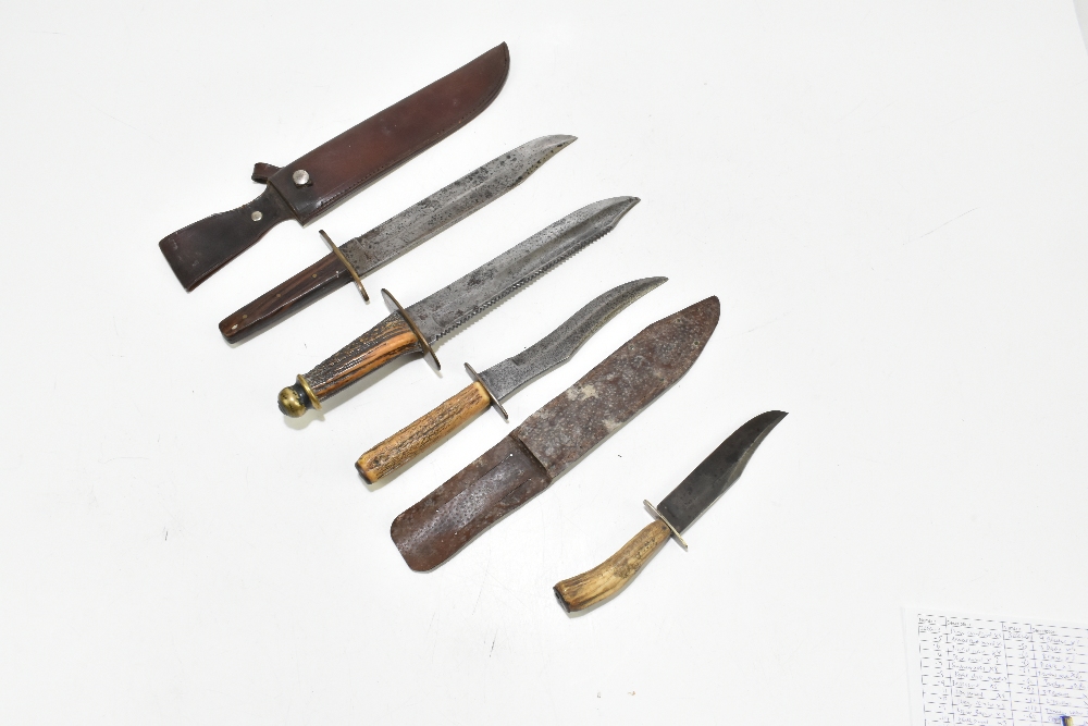 Four knives/daggers, the largest a sawback example with stamped marks to blade base, the brass guard - Image 6 of 11