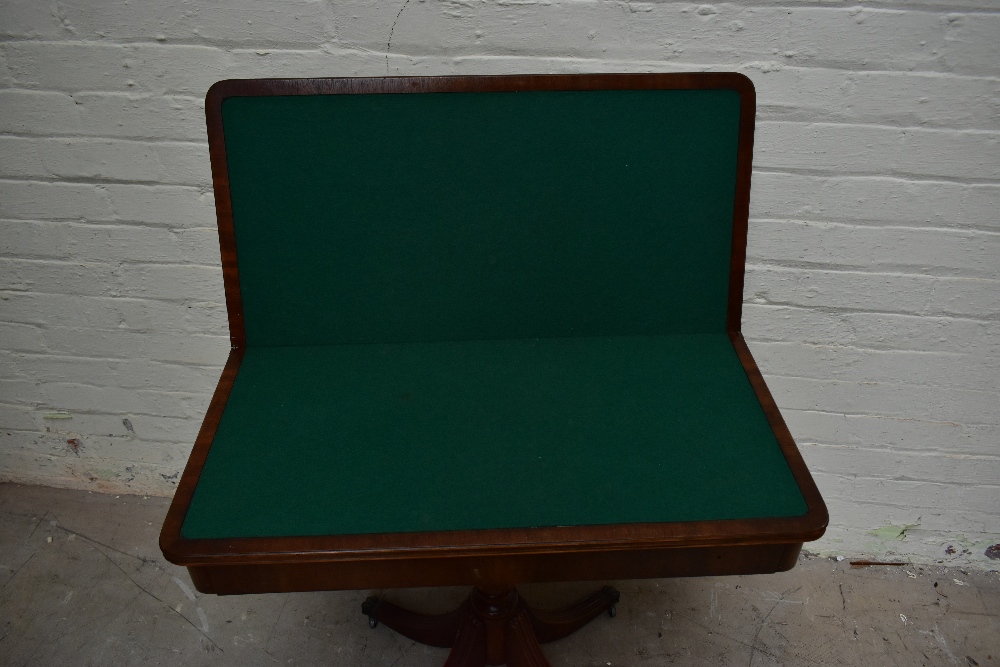 A reproduction mahogany veneered fold-over card table, raised on baluster from supports - Image 3 of 4