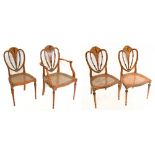 A good harlequin set of ten Edwardian Sheraton revival painted satinwood cane seated dining