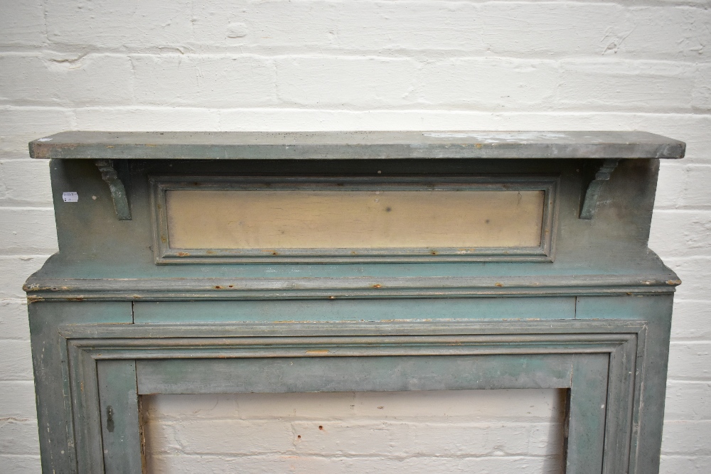 A 19th century green painted pine fire surround, height 138cm, width 113cm. - Image 2 of 2