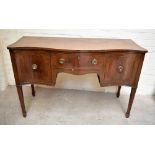 A 19th century mahogany and ebony strung serpentine fronted sideboard, the single frieze drawer