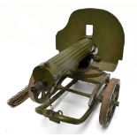 A Russian Maxim .762mm water cooled machine gun with integral steel plate shield and mounted on a