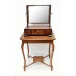 A 19th century mahogany dressing table mirror with three base drawers, raised on bracket feet,