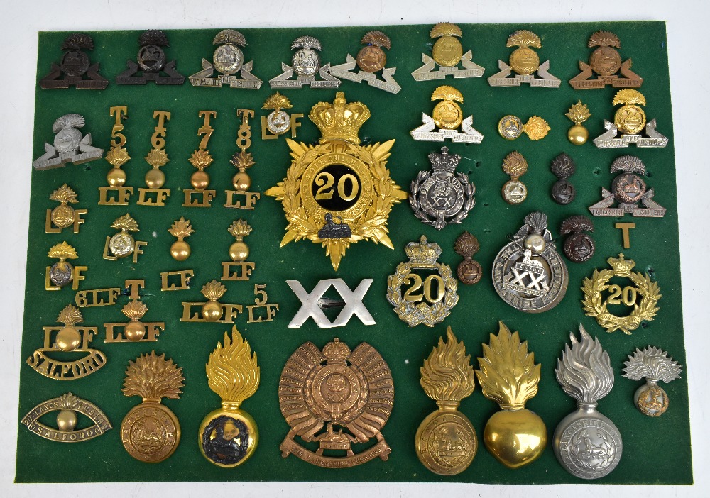 THE LANCASHIRE FUSILIERS; a good group of badges including a gilt helmet/shako plate for the 20th of