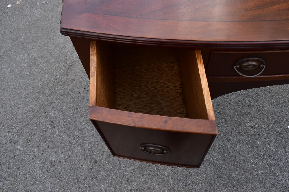 A reproduction mahogany veneered George III style side table, with three oak lined drawers, raised - Image 4 of 4