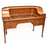 MAPLE & CO; a c.1900 satinwood and inlaid Carlton House desk by Raphael Lalli, the raised back