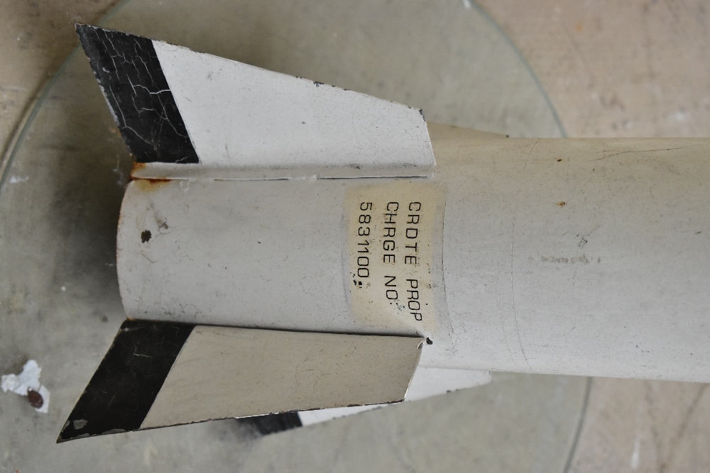 A painted metal model rocket/missile bearing various labels, length 136cm, with stand. Provenance: - Image 5 of 5