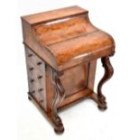 A mid-Victorian burr walnut piano top Davenport, the hinged top enclosing two short drawers, pull-