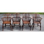 A near set of four 19th century yew wood and ash Windsor chairs, the stick hooped backs with pierced