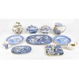 A collection of assorted blue and white ceramics to include meat drainers decorated in the '