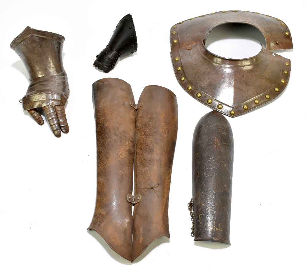 A group of steel armour sections comprising a collar with brass studs, a hinged vambrace, an