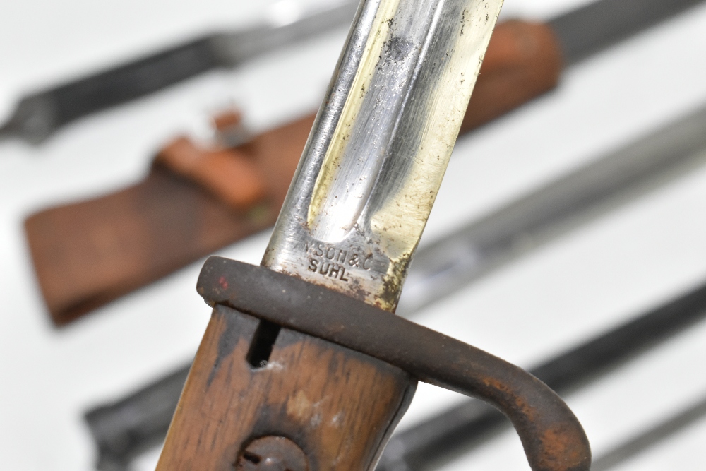 Four bayonets including two German and a socket example, two with scabbards and frogs, the two - Image 4 of 6