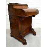 A Victorian burr walnut veneered piano topped Davenport, with lifting galleried back the shaped