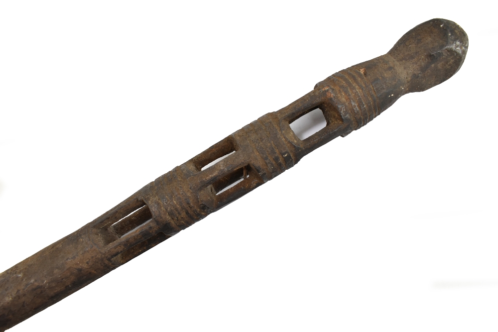 An early 20th century African tribal Betel nut carrier, length 113cm.
