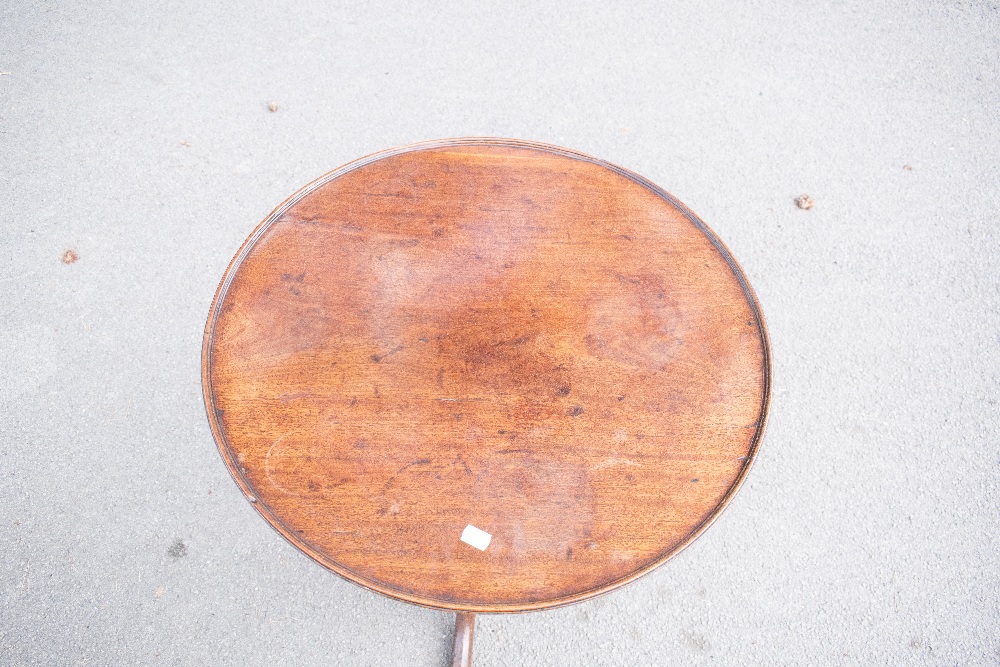 An early 19th century mahogany circular tilt top occasional table, the dished top with a moulded - Image 2 of 3