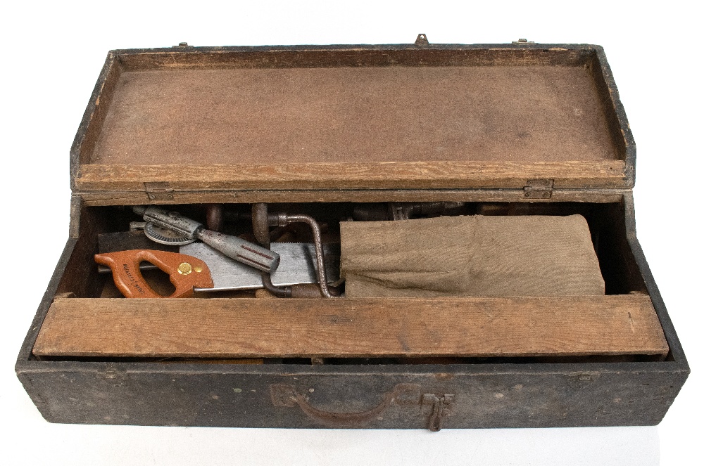 A tool chest housing a group of vintage tools including saw, chisels, brace, etc.Additional