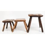 Three late 19th century rustic vernacular oak stools, the larger with a canted square top, height