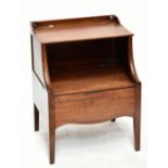 A George III mahogany two tier commode with hinged top and undertier on square tapered legs,