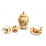 ROYAL WORCESTER; four pieces of blush ivory comprising a miniature three handled tyg painted with