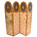 An Edwardian Sheraton revival pained satinwood four fold screen, each section with an oval cane work