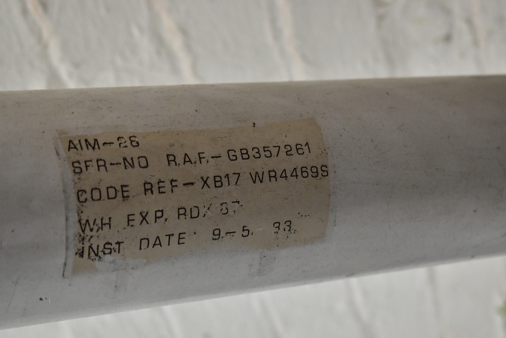 A painted metal model rocket/missile bearing various labels, length 136cm, with stand. Provenance: - Image 4 of 5