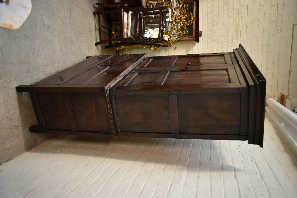 A 19th century oak cupboard on stand, the twin panelled doors an arrangement of hooks, above two - Image 2 of 4