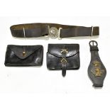 Two leather ammunition pouches, one with gilt badge of crossed rifles, a belt with line above