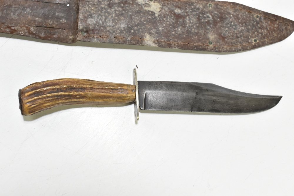 Four knives/daggers, the largest a sawback example with stamped marks to blade base, the brass guard - Image 2 of 11