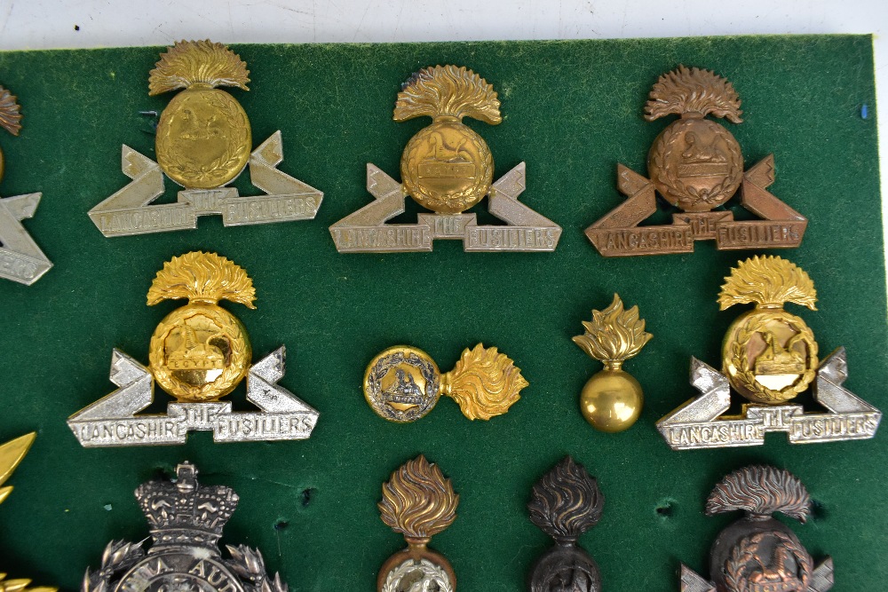 THE LANCASHIRE FUSILIERS; a good group of badges including a gilt helmet/shako plate for the 20th of - Image 8 of 10