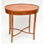 An Edwardian satinwood oval occasional table with quarter veneered top with shallow raised gallery