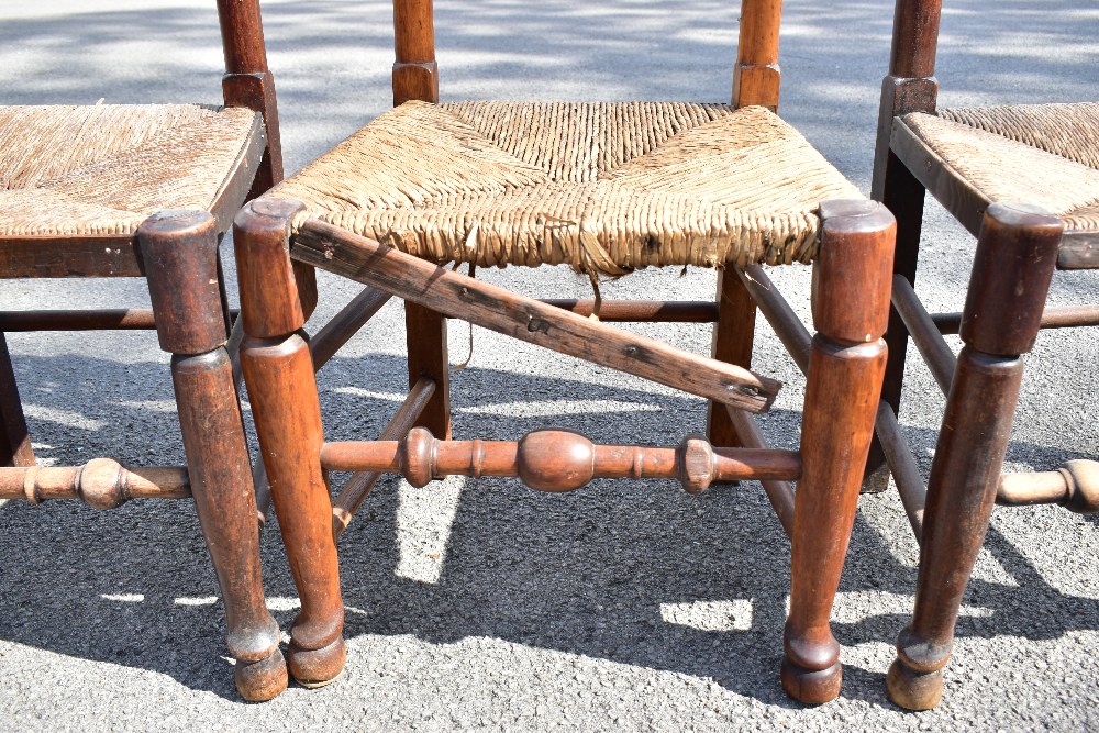 A harlequin set of six 19th century and later rush seated spindle back dining chairs, raised on - Image 3 of 4