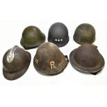 Six WWII and later helmets including a Brodie, American, French, further example labelled 'R' with