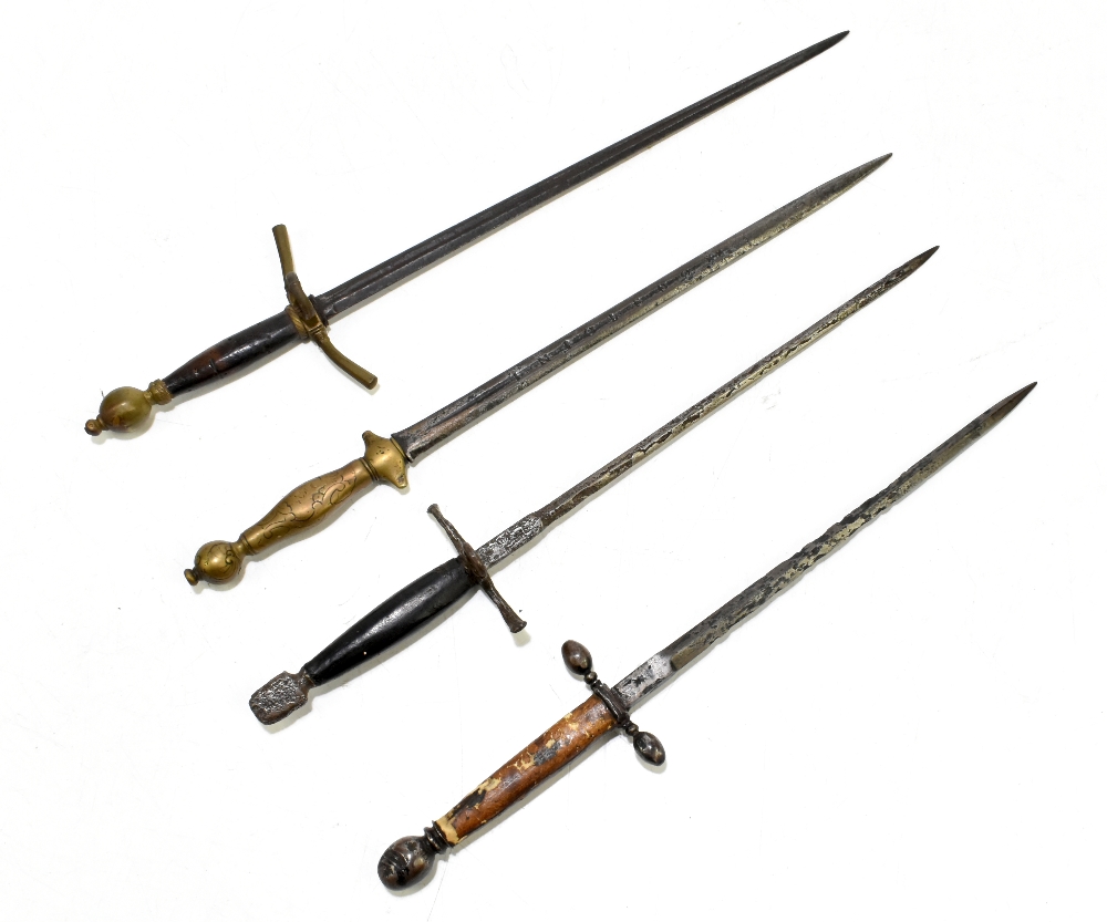 Four daggers including a parrying-type example, the brass hilted example stamped to blade 'In